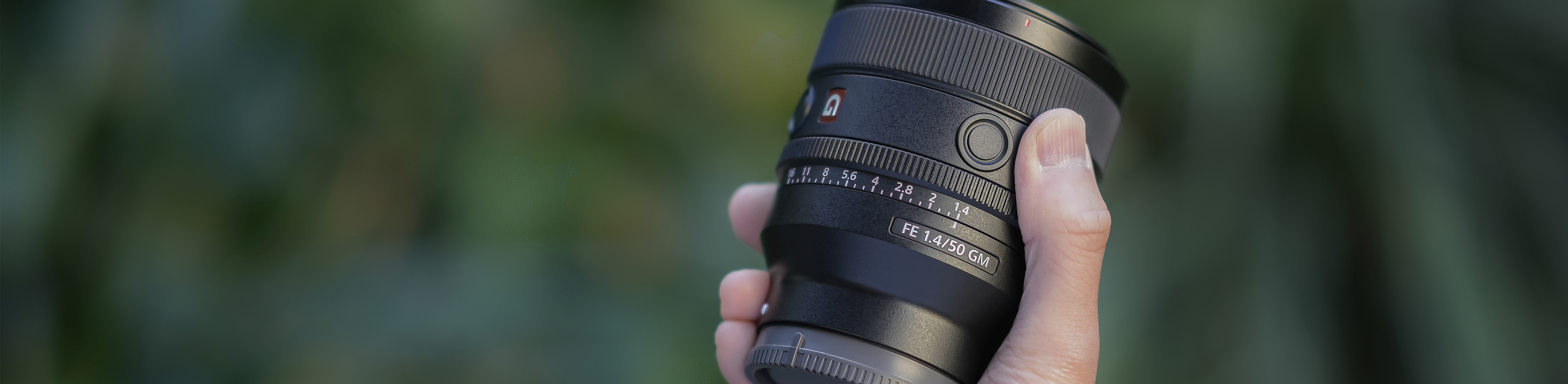 Lens being carried by hand