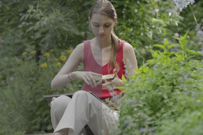 Woman sitting in a garden