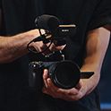 Camera operator taking shot of a woman