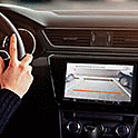 Image of the XAV-AX4050 in a dashboard with a live video from the reversing camera on-screen