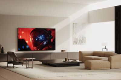 BRAVIA 9 II on its Mirage Stand displaying a vivid scene of an astronaut in a modern living room