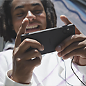 Image of a person playing a game on a black Xperia 5 V