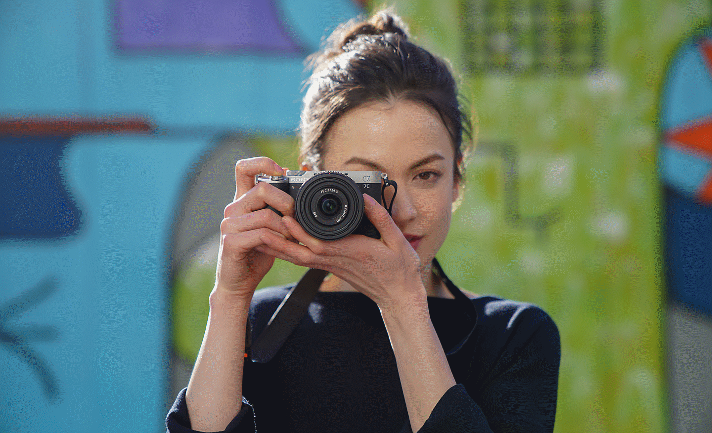 Portrait of woman taking photos outdoor