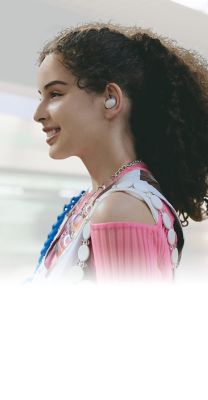 Image of a woman standing on a subway platform