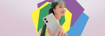 Image of a person holding a silver Xperia 5 V on a pink background with colourful shapes