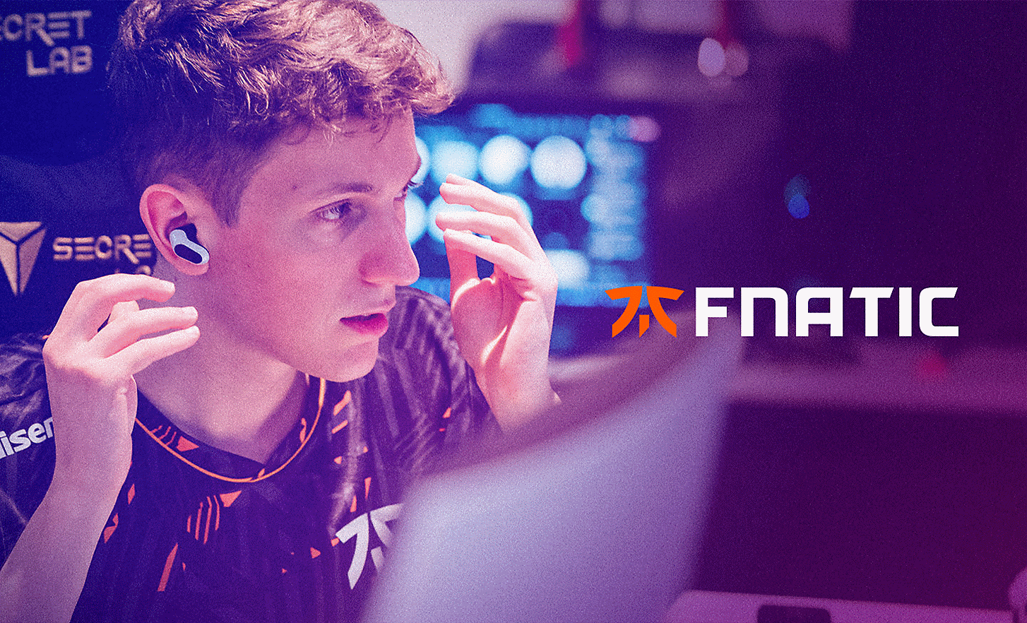 A FNATIC gamer positioning the INZONE Buds in their ears