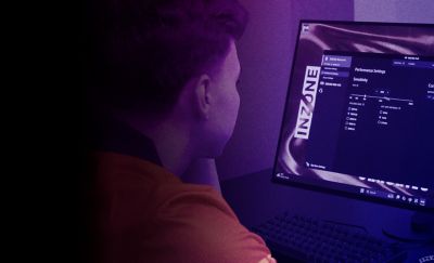 An INZONE gamer customising monitor settings.
