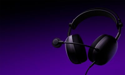Black headphones with mic on a black and purple background