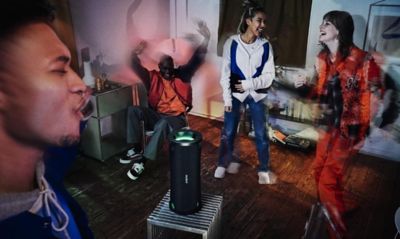 Image of ULT FIELD 7 portable speaker and group of young people danging in the living room